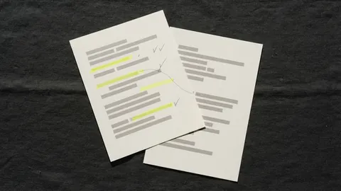 Two overlapping printed pages, highlighted lines on the top page joined by a thin pencil line to their match on the page below