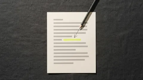A printed page with a pencil drawing an arrow straight to one highlighted line