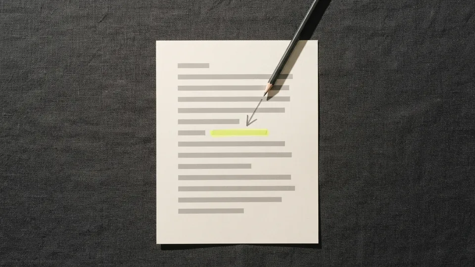 A printed page with a pencil drawing an arrow straight to one highlighted line