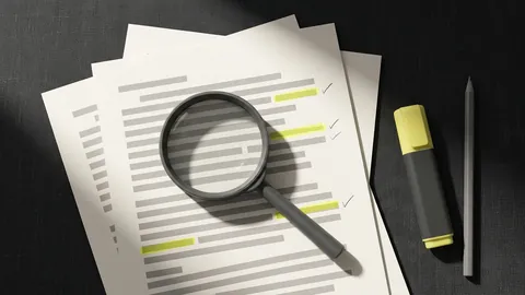 A magnifying loupe over a printed page where single lines are marked in yellow and ticked in pencil in the margin